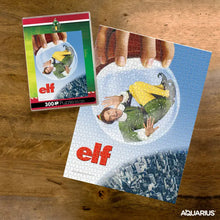 Load image into Gallery viewer, Elf Movie Poster 300pc Puzzle in VHS Style Clamshell Case by Aquarius
